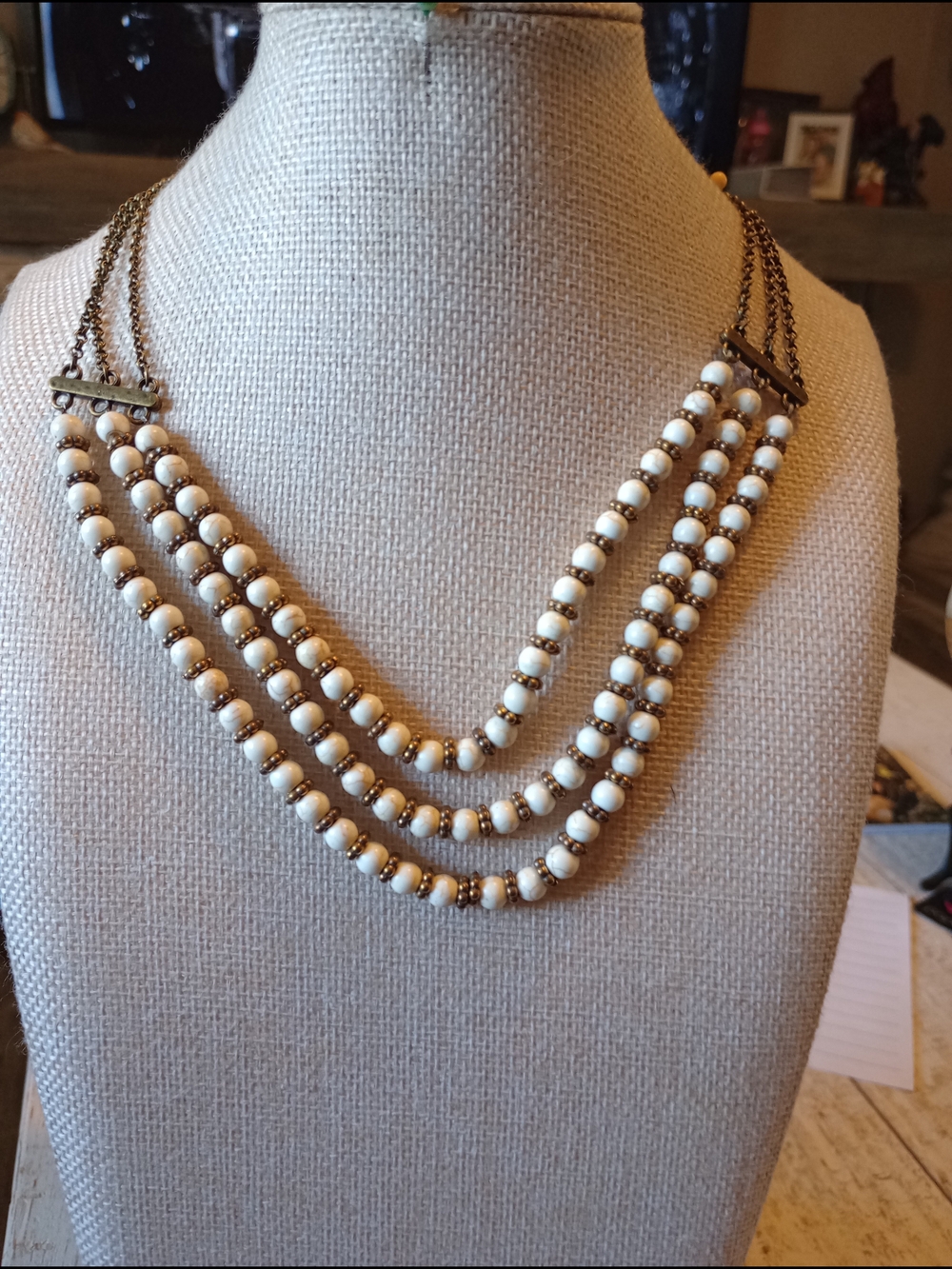 Three-Strand Cream Crackle Stone Beaded Necklace with Brass Accents